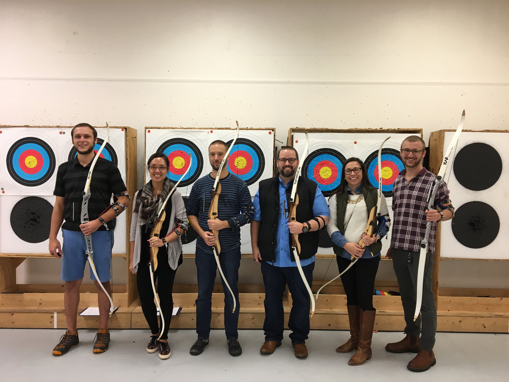 Abilitie team members at an archery lesson