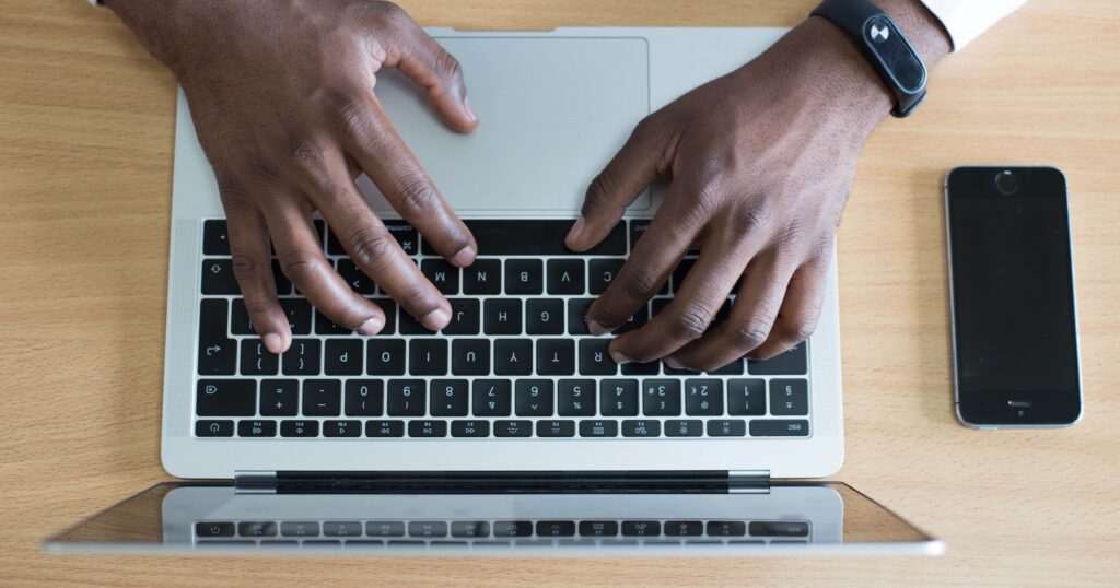 Man typing on laptop